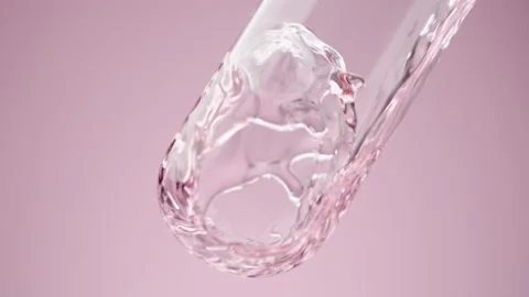 Сlear pink liquid is poured into a laboratory glass tube Stock Footage 178403699