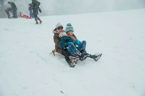 Sledding Down the Hill Fotos Stock