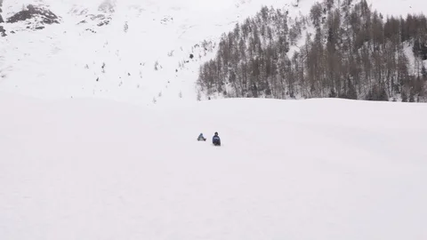 Sledding Down Snow Mountain, Low Angle View Stock Footage 127571264