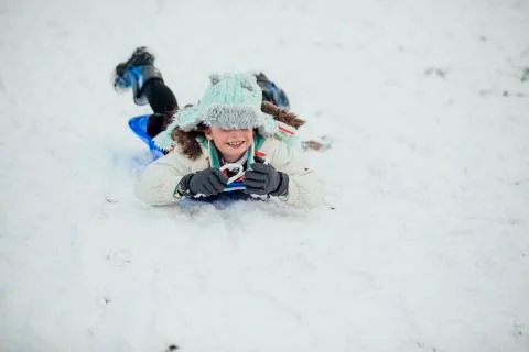Sledding in the Park Stock Photos