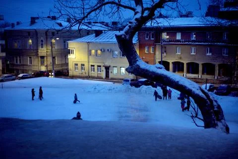 Sledding off a snow slide. Foto stock