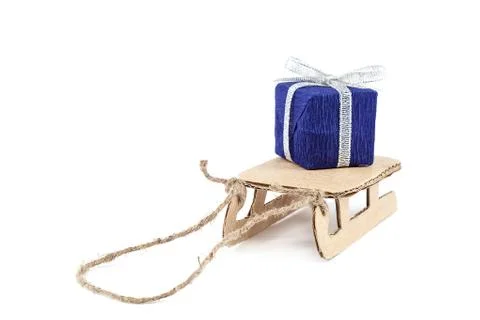 Sledge with gift on white background. Stock Photos