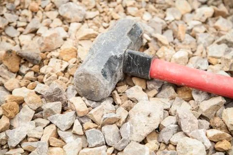 Sledge hammer on rubble Stock Photos