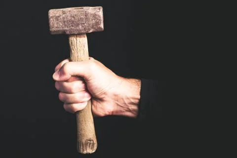 Sledge-hammer - tools in a man hand - maintenance service concept Stock Photos