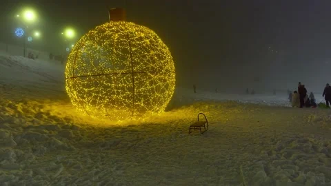 A sledge next to a light art in a skiing resort Stock Footage 234735889
