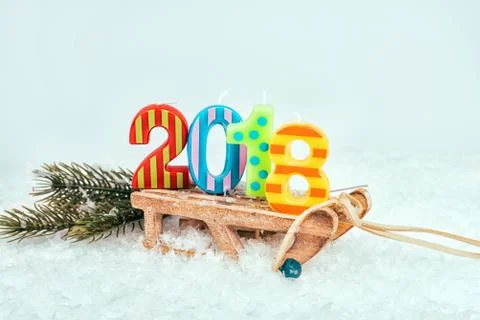 Sledge on snow with figures 2018. Stock Photos
