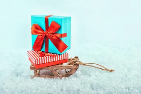Sledge on snow with presents. Stock Photos
