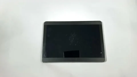 Sledgehammer falls vertically onto a Tablet Video stock 150267602