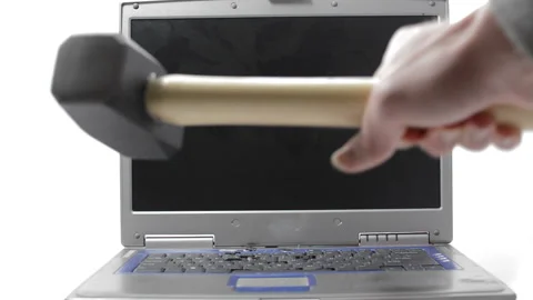 A sledgehammer hammers a laptop screen Video stock 150637216