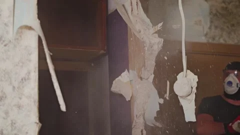 Sledgehammer Impact Smashes Interior Wall During Apartment Demolition 스톡 동영상 338430952