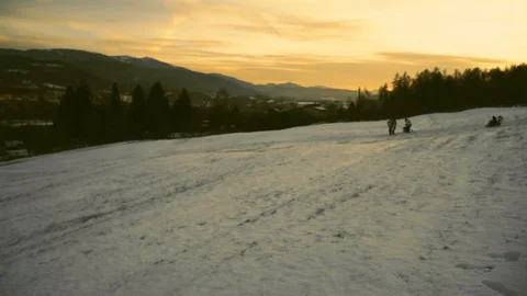 Sleds on the snow at sunset Stock Footage 92365825