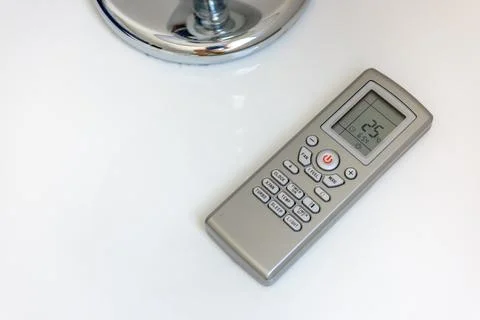 Sleek Air Conditioner Remote Control on Table Stock Photos