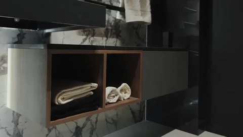 Sleek and Modern Bathroom Storage Solutions Featuring an Elegant Marble Design Stock Footage 311249512
