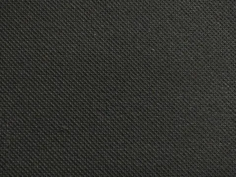 A sleek, black textured background featuring a subtle diamond pattern, evokin Stock Photos