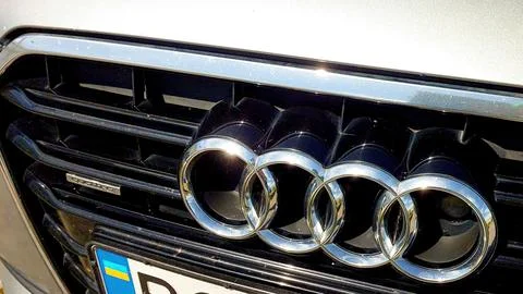 Sleek Car Audi Front Featuring Distinctive Metal Logo in Sunlight Stock Photos