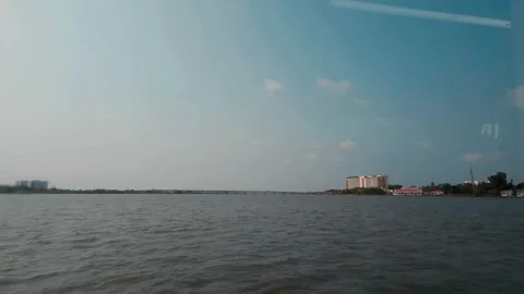 A sleek, electric ferry glides through calm waters, its white and purple hull st 库存影片 336440703