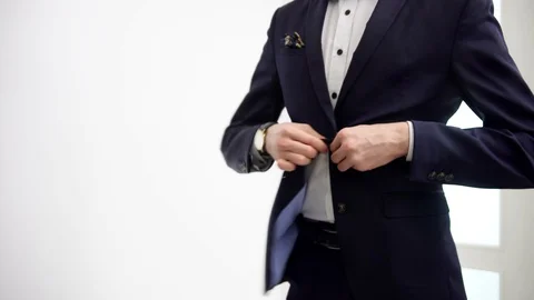 Sleek elegant formal suit being buttoned in style and time being checked, 動画素材 106200745
