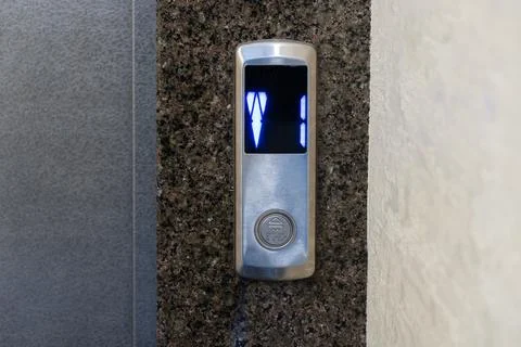 A sleek elevator panel with illuminated floor buttons fits perfectly with t.. Фото
