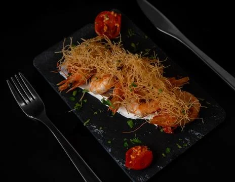 Sleek Fork on Dark Dining Backdrop Stock Photos