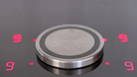 A sleek induction cooktop heating element ready for culinary creativity in a mod Stock Footage 281597969