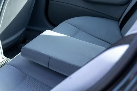 Sleek interior design features soft blue-gray upholstery and a practical ar.. Stock Photos