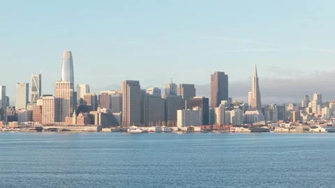 Sleek lines of urban development run parallel to the gentle arc of the Stock Footage 309172954