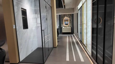 Sleek Modern Bathroom Showroom Interior with Vanities, Mirrors, and Decorative Stock Footage 336170914