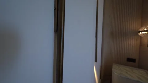 Sleek Nightstand Soft Lighting: Modern Bedroom Mood 스톡 동영상 309761173