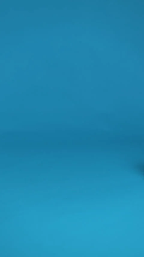 A sleek silver suitcase with an extended handle, ready for travel. Stock Footage 276941736