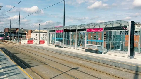 Sleek Tram slowly pulls into Birmingham Station Video stock 79243706