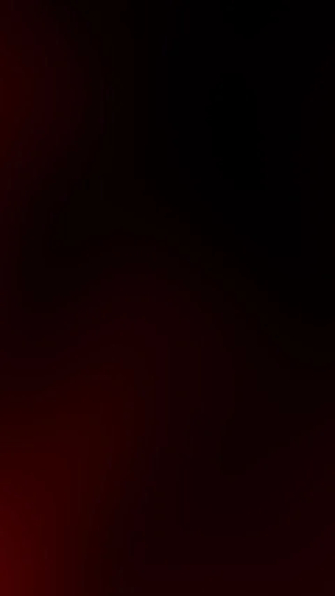 A sleek vertical animated background featuring deep red and black gradients Stock Footage 290143781