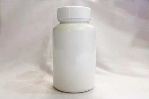 Sleek White Supplement Bottle on Pristine Background Stock Photos