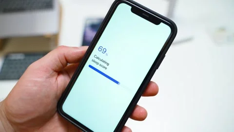 Sleep score calculation stuck at 70 percent on a smartphone in hand. Frozen Stock Footage 342940100