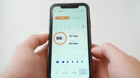 Sleep tracking app on smartphone screen showing sleep quality score and duration Stock Footage 342940621