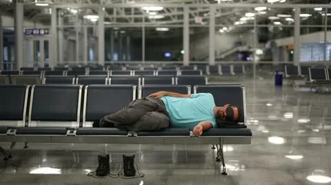 Sleeping in airport with eye cover Stock Footage