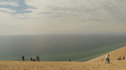 Sleeping Bear Dune Area (Part 6:  Unidentifiable People on Dunes B) Video stock 24975984