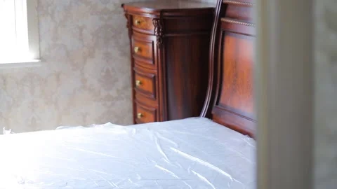 Sleeping bed, chest of drawers Stock Footage 156237988