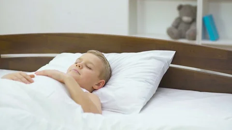 The sleeping boy lay on the bed. Real time capture Stock Footage 71964743