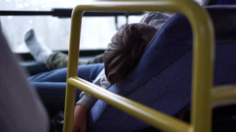 Sleeping on the bus while it's moving Stock Footage 256851010