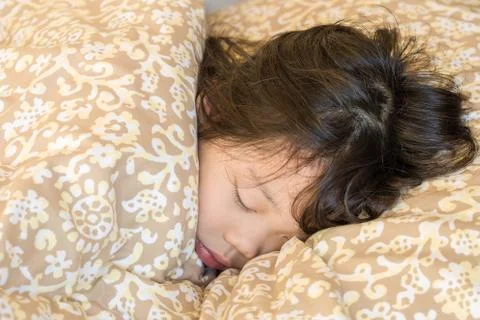 Sleeping Child in Bed Stock Photos