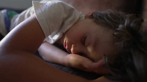 Sleeping child lying on couch napping. Kid in deep slumber asleep during afte Stock Footage 221233597