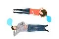 The sleeping couple lay near the dialog signs. View from above Photo