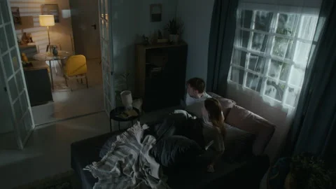 Sleeping Couple Waking up Scared by Poltergeist in Bedroom at Late Night Stock Footage 311567359