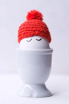 Sleeping egg with a red hat Stock Photos
