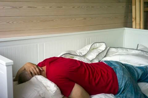 Sleeping exhausted man 写真素材