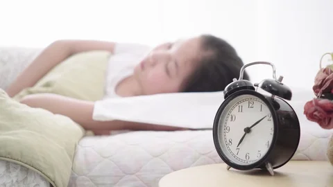 Sleeping girl on a bed Stock Footage 106521863