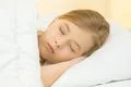 The sleeping girl lay on the bed Photo