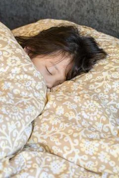 Sleeping Kid in Bed Stock Photos