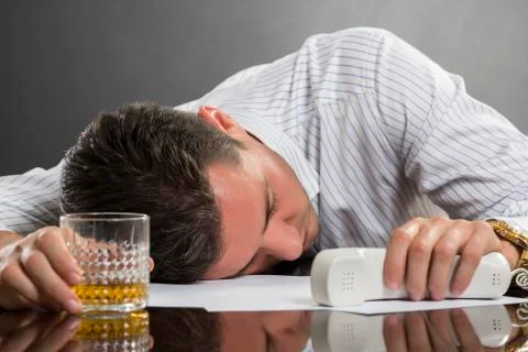 Sleeping man with drinking problems Stock Photos