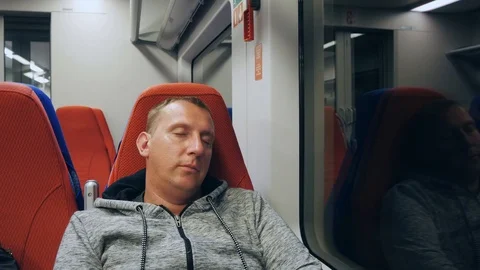 Sleeping man in a subway car. Stock-Footage 117906799
